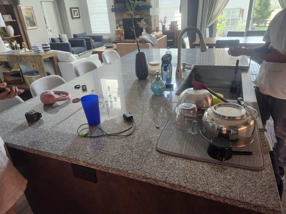 Kitchen island with granite countertop before remodel in Erie, CO