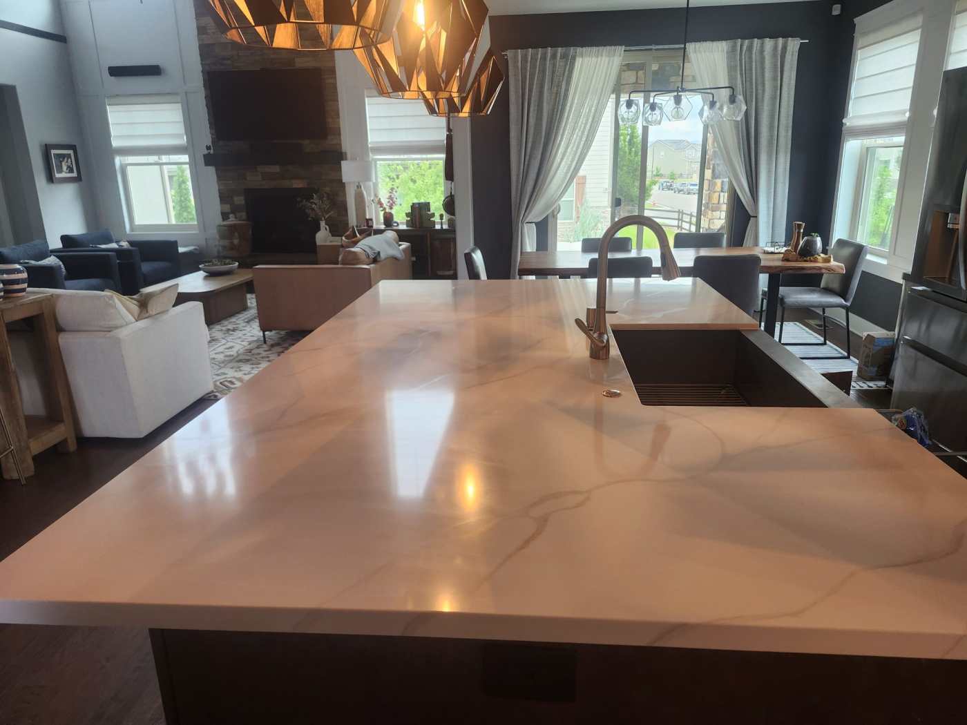 Kitchen island with white quartz countertop after remodel in Erie, CO